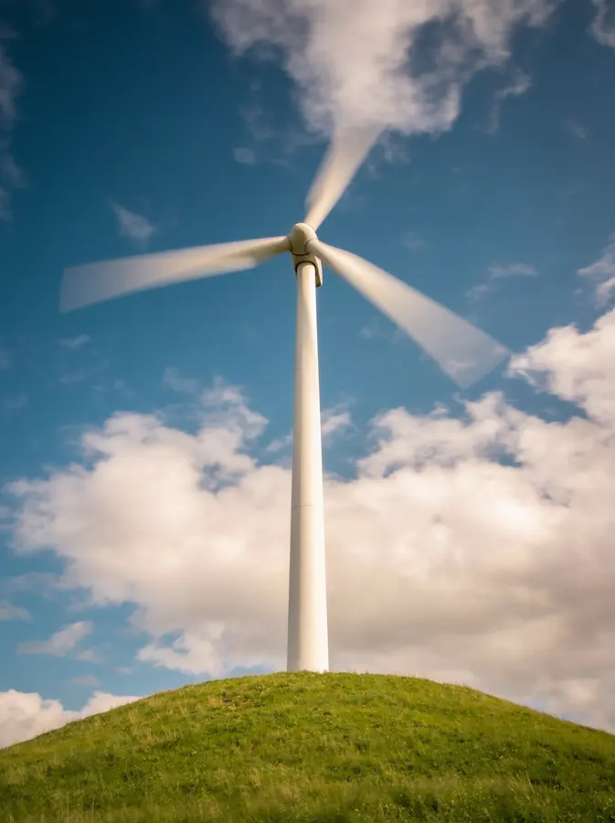 Wind turbine farm on green hills