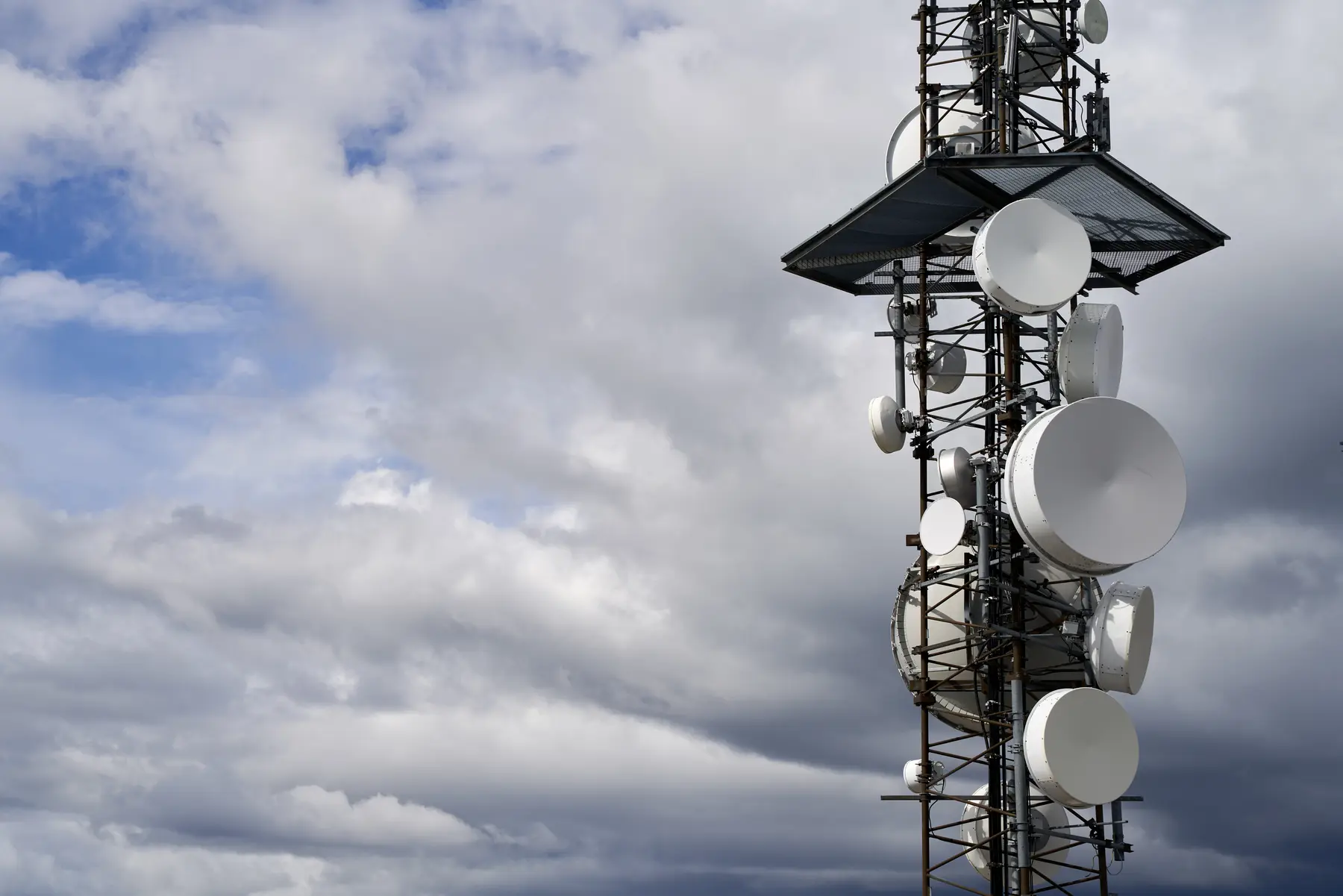 Telecommunications towers against a cloudy sky, among the most frequently struck structures